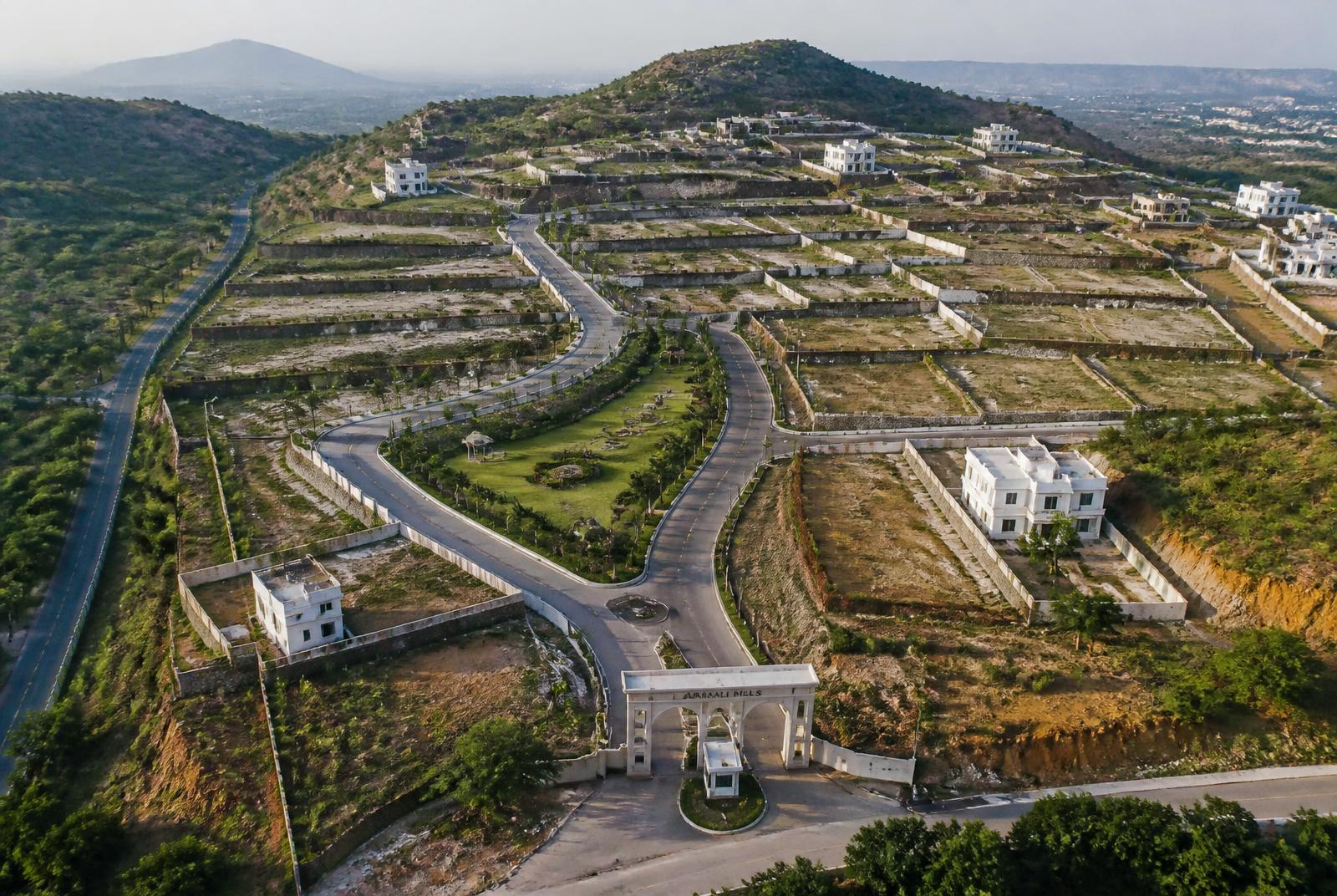 Terraced hillside plots by Janjaes Infra